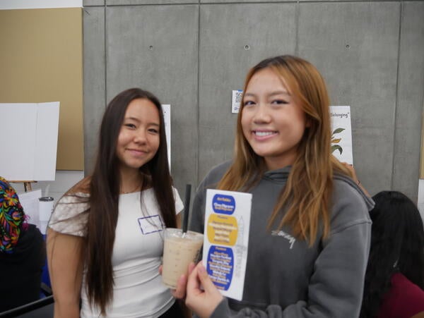 Students celebrating during the Rewrite Rebuild Symposium (with boba)